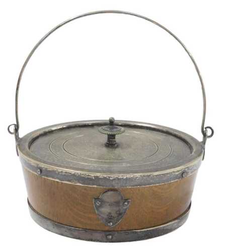 A late 19thC oak and silver plated butter dish, with loop handle and circular cover enclosing a...