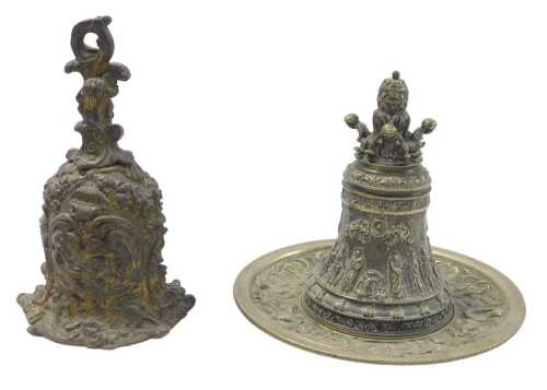 A 19thC Continental gilt metal bell, decorated with rococo scrolls, putti, etc., 15cm high, and...