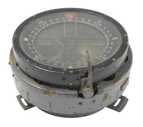 An aviator's compass, painted in black, the base in grey, 19cm diameter.