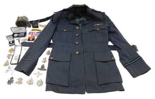 A collection of RAF related items, to include a jacket, buttons, badges, a hydraulic accumulator...