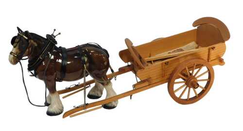 A Melbaware pottery shire horse, wearing tack, printed marks, 28.5cm high, together with a...