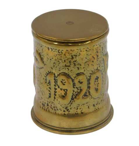Trench Art. A World War I shell case converted to a jar and cover, with hammered and leaf...