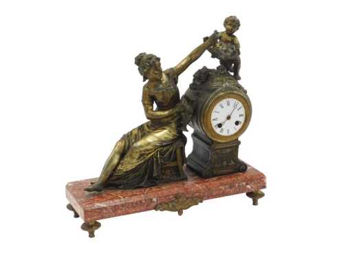 A late 19thC French figural mantel clock, with a gilt patinated white metal drum head clock,...