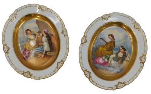 A pair of Pickman Sevilla porcelain plates, each of oval form, hand-painted centrally with...