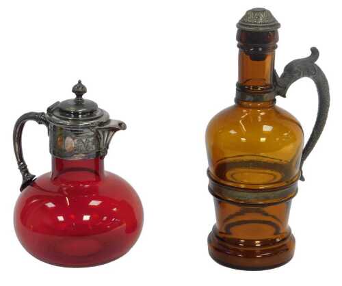 A late 19th/early 20thC German amber tinted glass jug, with metal mount and sea creature handle,...