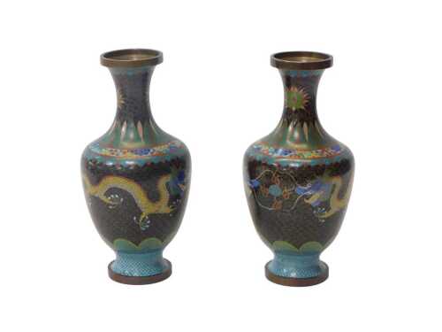 A pair of Chinese black cloisonne vases, each of shouldered form, decorated with dragons against...