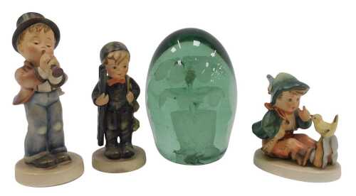 A 19thC green glass dump paperweight, decorated with a flower in a pot, 12cm high, together with...