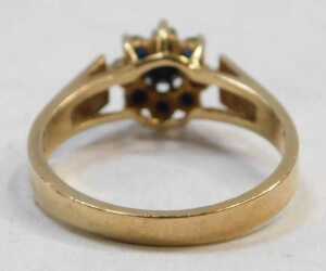 A 9ct gold cluster ring, set with nine dark blue sapphires, in a floral cluster setting,... - 2