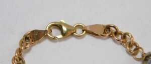 A 9ct gold bracelet, set with five vari-coloured blue beads at intervals, with a lobster claw... - 2