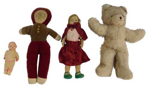 Three early/mid 20thC dolls, comprising a miniature composition doll, wearing knitted clothing,...