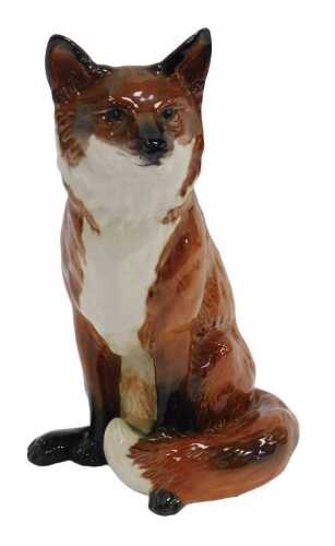 A Beswick pottery fireside figure, modelled as a seated fox, printed marks, numbered 2348, 31cm...