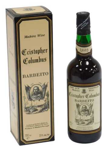 A bottle of Christopher Columbus Barbeito Madeira wine, 700ml, boxed, with an outer wooden box.