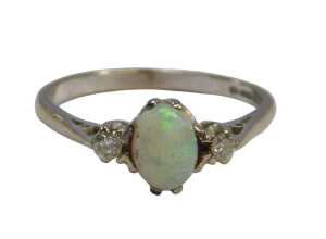 An 18ct white gold opal and diamond three-stone ring, in a claw setting, size O, 2.7g all in.
