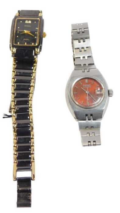 Two lady's fashion watches, comprising a Lee Cordon 18ct gold plated blackened effect wristwatch,...