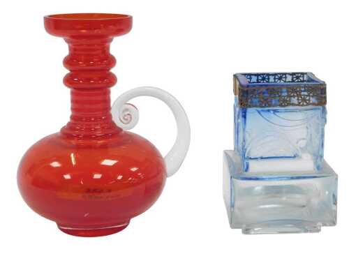 A Tamara Aladin for Riihimaen Lasi red glass ewer, with a ribbed column and compressed circular...