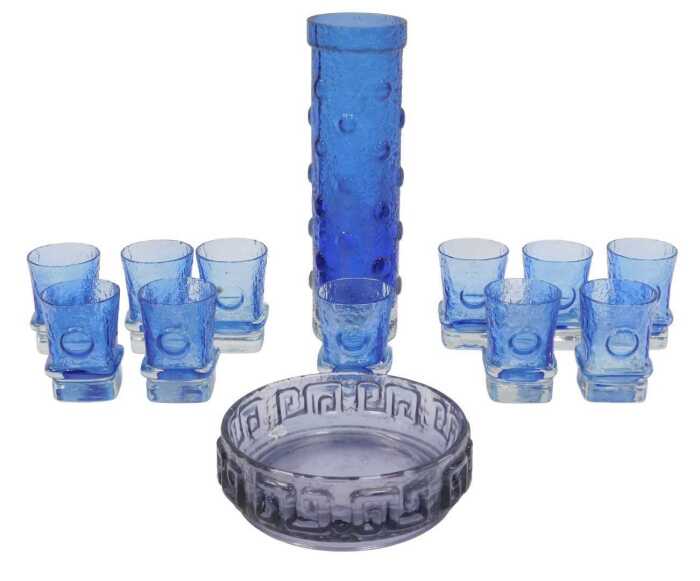 A Helena Tynell for Riihimaen Lasi cylindrical blue-tinted glass vase, with raised roundel...