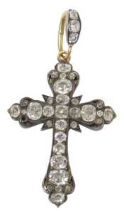 A diamond crucifix pendant, set with varying sized old mine cut diamonds, the largest end four...