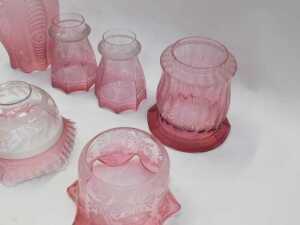 A group of Victorian and later cranberry glass oil lamp and other shades, predominantly etched... - 2
