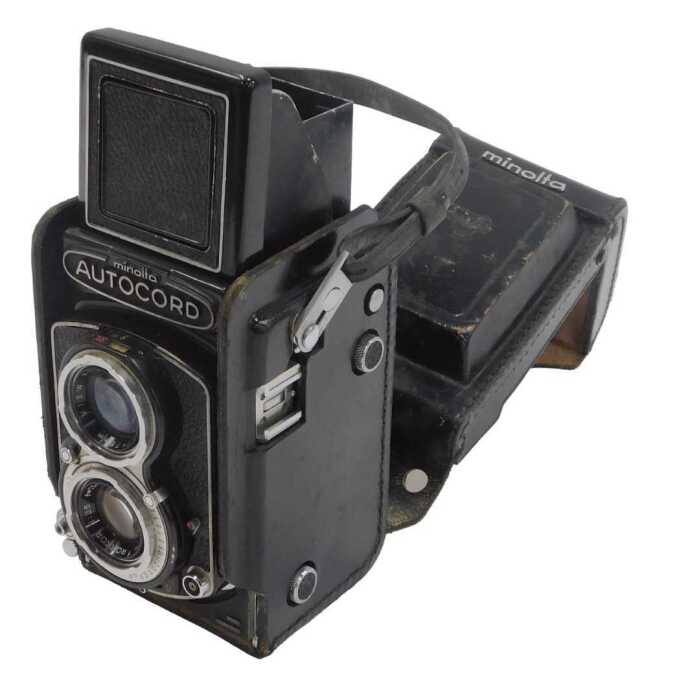 A Minolta Auto Cord twin lens reflex camera, in a black leather case.