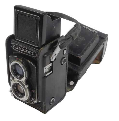 A Minolta Auto Cord twin lens reflex camera, in a black leather case.