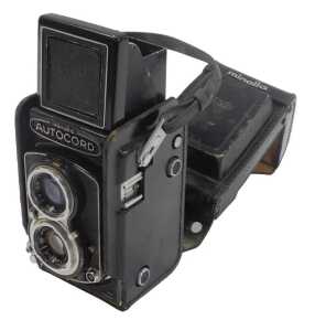 A Minolta Auto Cord twin lens reflex camera, in a black leather case.