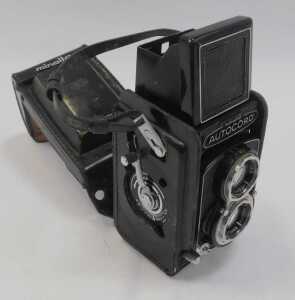 A Minolta Auto Cord twin lens reflex camera, in a black leather case. - 2
