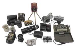 A group of cameras and optical-related items, to include a Coronet Twelve-20 camera, a Polaroid...