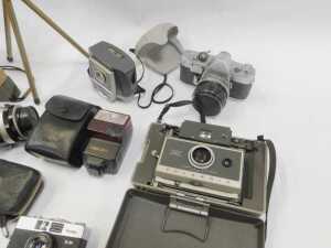 A group of cameras and optical-related items, to include a Coronet Twelve-20 camera, a Polaroid... - 2