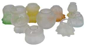A group of Victorian and later oil lamp shades, to include a vaseline glass example, a graduated...