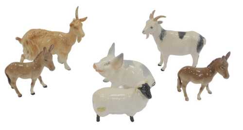 A group of Beswick pottery animals, comprising two goats, two donkeys, a sheep, and a pig. (AF)