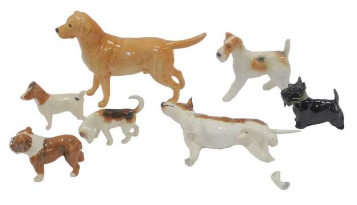 A group of Beswick pottery dogs, to include black glazed West Highland terriers, 7cm high,...