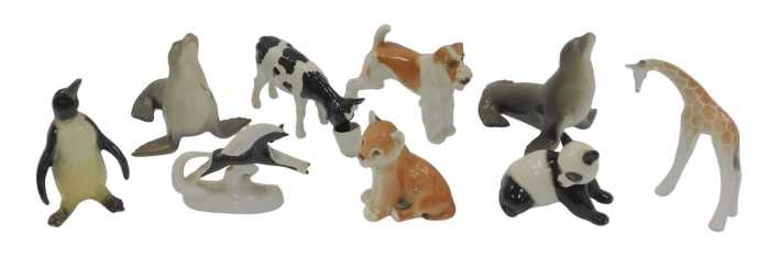 A group of Lomonosov and other pottery animal figures, to include penguin, 14cm high, dogs,...