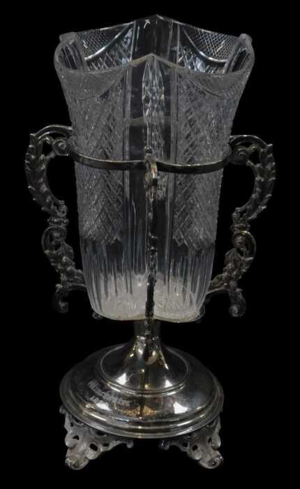 A Victorian silver plated and cut glass vase, the removable cut-glass central section within a...