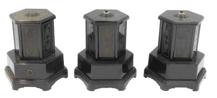 Three Selcol plastic wind-up musical cigarette dispensers, in black, 21cm high.