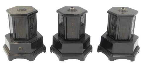 Three Selcol plastic wind-up musical cigarette dispensers, in black, 21cm high.