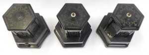 Three Selcol plastic wind-up musical cigarette dispensers, in black, 21cm high. - 2