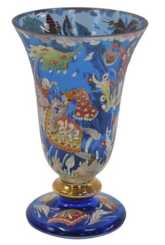 A 20thC Continental blue glass vase, of trumpet form, decorated in coloured enamels depicting...