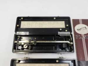 Two Allbrit planimeters, each in a black Bakelite case, 24.5cm wide, together with two... - 2