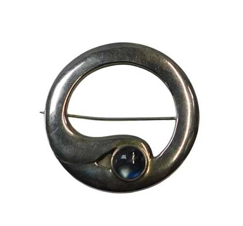A Scottish silver modernist style circular brooch, by TJL, Edinburgh hallmarks, inset with a...