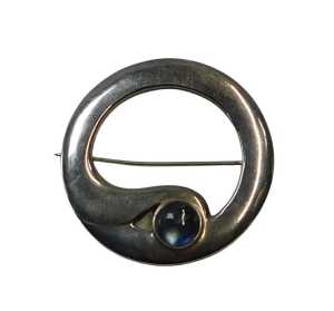 A Scottish silver modernist style circular brooch, by TJL, Edinburgh hallmarks, inset with a...