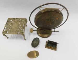 A group of brassware, comprising a gong, 26cm high, with striker, a pierced trivet, decorated... - 2