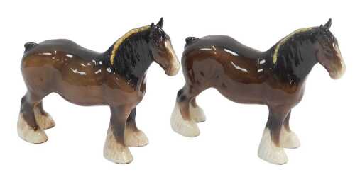 Two Beswick pottery shire horses, printed marks, 22cm high.
