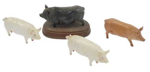 Two Beswick pottery Champion Wall Boy pigs, 7cm high, together with a Royal Doulton Tamworth pig,...
