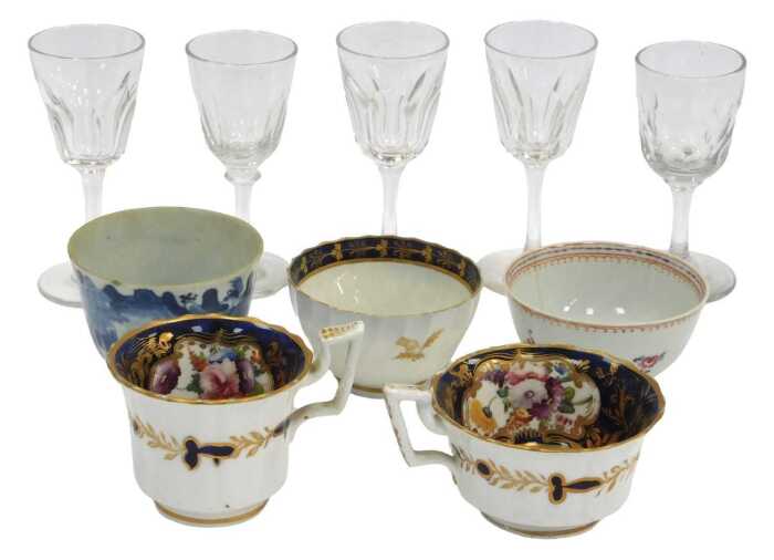 An 18thC Chinese blue and white tea bowl, together with a Chinese export famille rose tea bowl,...