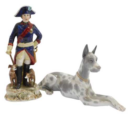 A Lladro porcelain figure, modelled as a recumbent Great Dane, 17.5cm high, together with a...