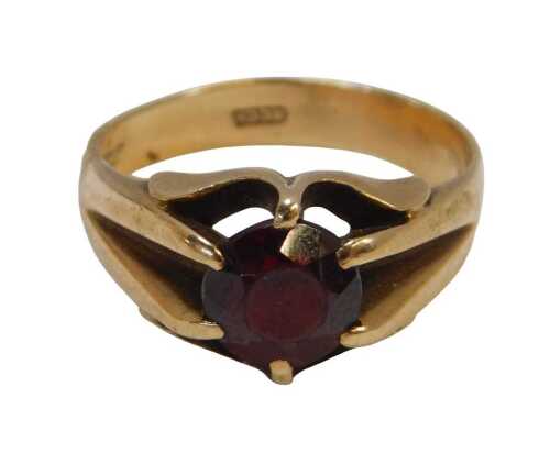 A 9ct gold and garnet single-stone ring, the oval garnet in a four-claw setting, size Q&frac12;, 5.3g...