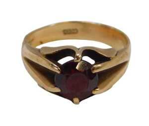 A 9ct gold and garnet single-stone ring, the oval garnet in a four-claw setting, size Q&frac12;, 5.3g...