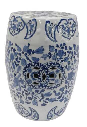 A Chinese blue and white porcelain garden seat, of barrel form, decorated with dragons and...