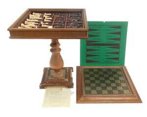 A Studio Anne Carlton Battle of Hastings resin chess set, contained in an oak chess table, 62cm...