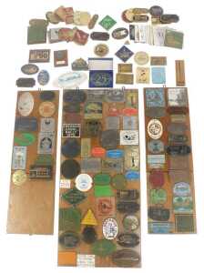 A collection of canal boat racing festival and other plaques, some loose and others mounted.
